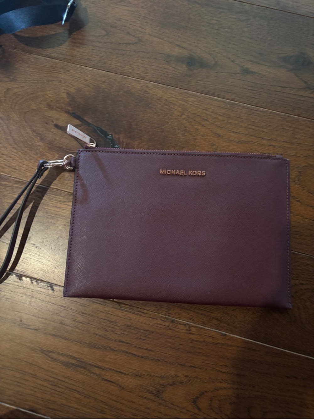 Michael Kors Men's Wrist Pouch in Plum Burgundy with Gold Hardware